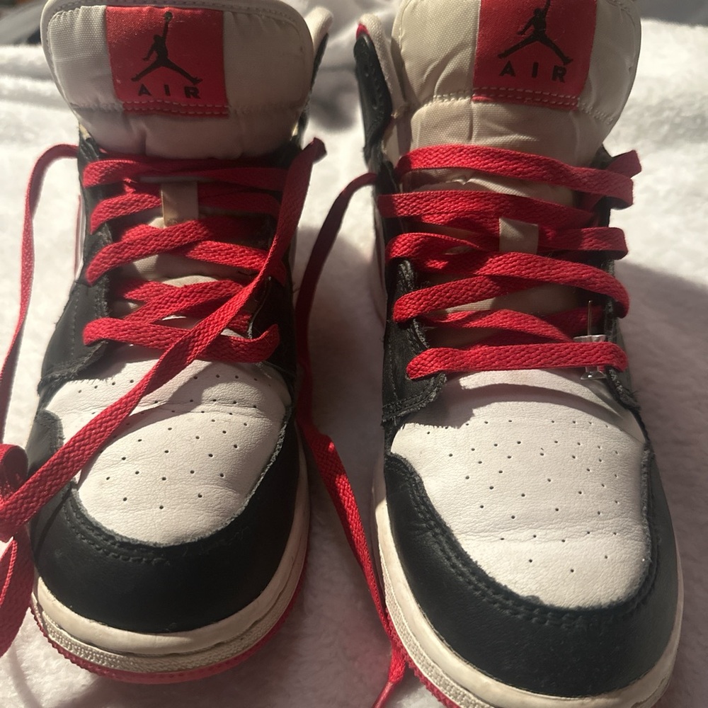 red & black Nike Jordans